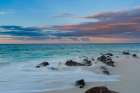 LIndian Ocean surf surging onto a rocky beach at sunset Anse Bambous Beach-Seychelles Coastal Print